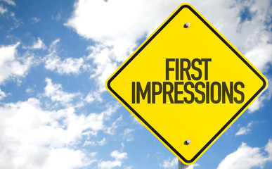 First Impressions sign with sky background
