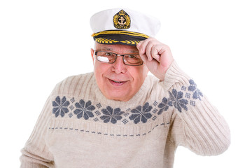Closeup portrait of old senior man with a boat captain cap. Isol