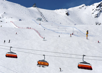 Fototapeta na wymiar Skiers and chairlift in Solden, Austria