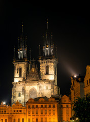 Fototapeta na wymiar The Tyn Church in the light of lanterns evening. Located on the Old Town Square in Prague