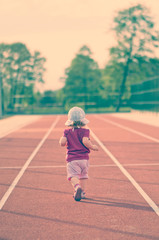 Fototapeta premium little girl on the treadmill