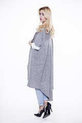 Young slim sexy woman in fashionable dress isolated on white bac