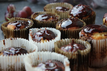 cupcakes in chocolate on a wooden board  