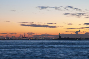 Liberty Island and Harbour of New Jersey at evening after sundown, New York, USA
