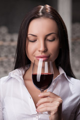 Pretty female liquor store assistant in storage