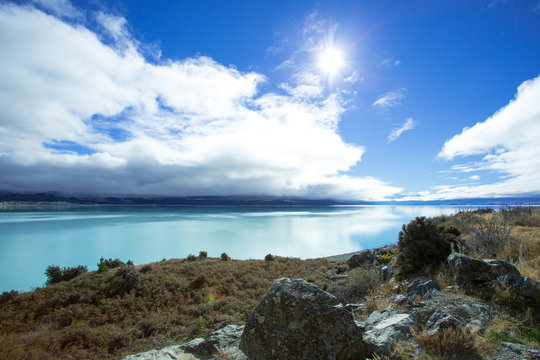 Lake Pukaki is fed from melting of the Tasman and Hooker Glaciers. The Lake has a distinctive blue color, that is caused by glacial flour, fine rock particles from the glaciers.