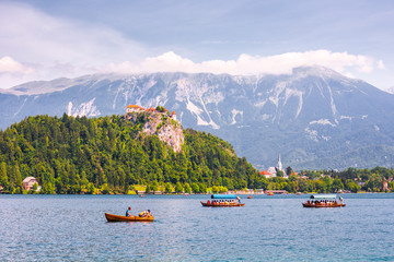 Bled Castle on a Precipice Overlooking Bled Lake with Tourists a