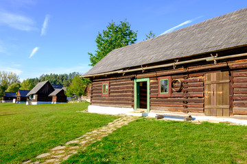 Fototapeta na wymiar Old wooden barn and traditional village houses, Slovakia