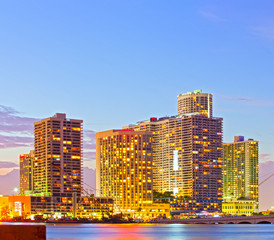Miami Florida at sunset, colorful skyline of illuminated buildings