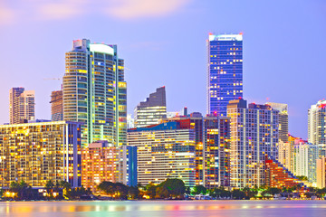 Miami Florida at sunset, colorful skyline of illuminated buildings