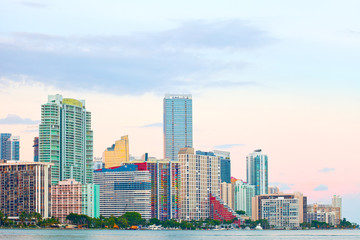 Fototapeta na wymiar Miami Florida at sunset, colorful skyline of illuminated buildings
