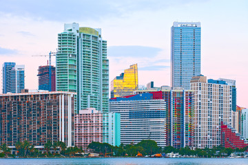 Miami Florida at sunset, colorful skyline of illuminated buildings - 93736594