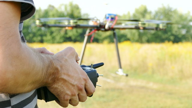 
Pilot's hands with  radio transmitter,  operate of drone.4K 3840x2160
