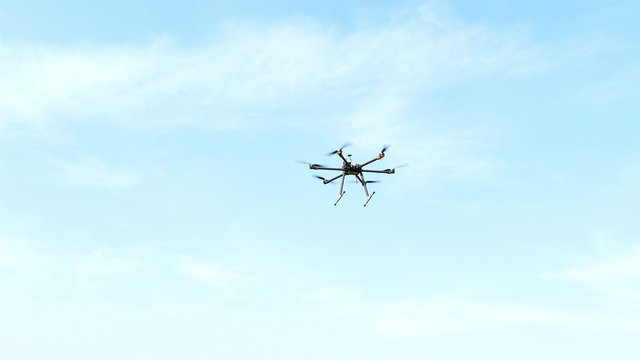 

Drone fly away  in air  against  blue sky .4K 3840x2160
