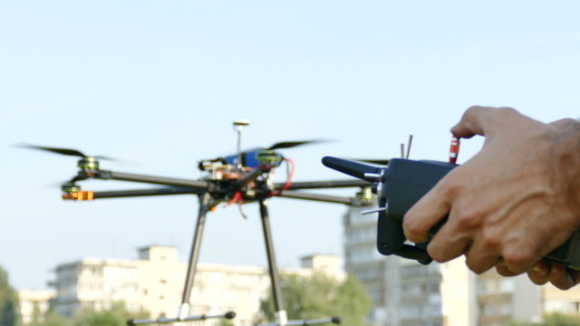 

Pilot's hands with  radio transmitter,  operate of drone.4K 3840x2160
