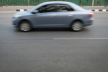 car fast motion blurred driving on road