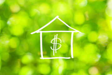 Hand drawing house and dollar sign with green bokeh effect