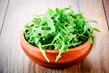 Arugula on Dark Woody Background