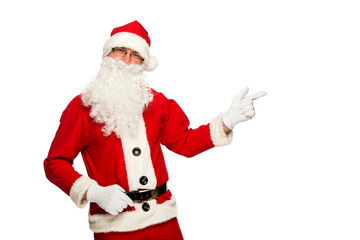 Santa Claus pointing sign with smile, isolated on white