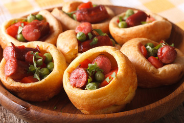 homemade Yorkshire pudding with sausages close-up. Horizontal
