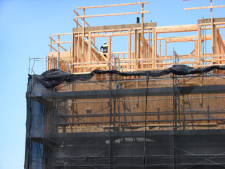 building in framing stage on construction site