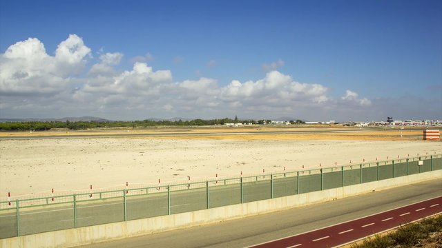 Time lapse view of Faro airport track in cloudy afternoon, located in Algarve