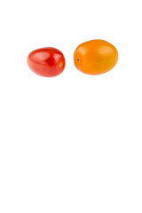 Yellow and red cherry tomatoes on white background