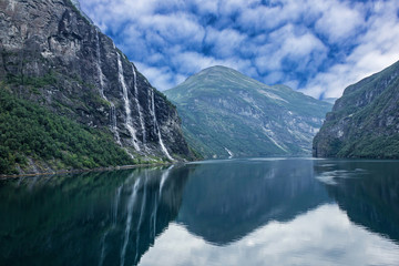 Fototapeta na wymiar Geiranger fjord, Norway: landscape with mountains and waterfalls