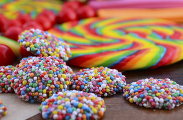 Assorted candy with brown paper bag.