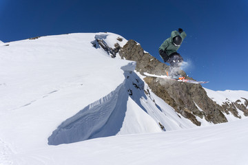 Flying skier on mountains, extreme sport