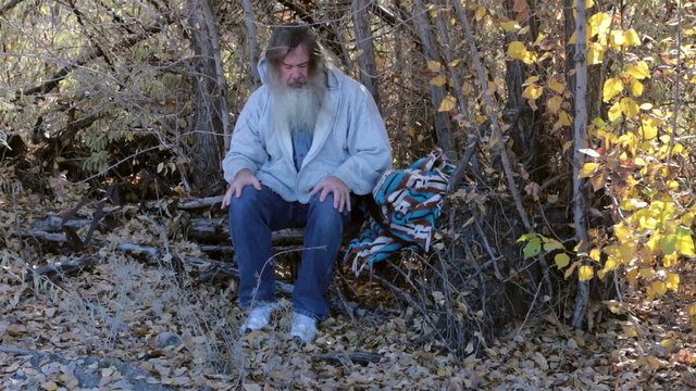 Man homeless in park trees drug addiction itching HD 0150