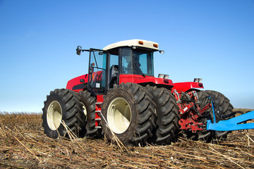 Powerful tractor working in the field