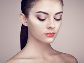 Beautiful woman face. Perfect makeup. Beauty fashion. Eyelashes. Cosmetic Eyeshadow. Highlighting