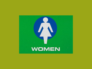 green and blue women restroom sign