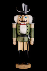 wooden toy soldier nutcracker isolated on black background
