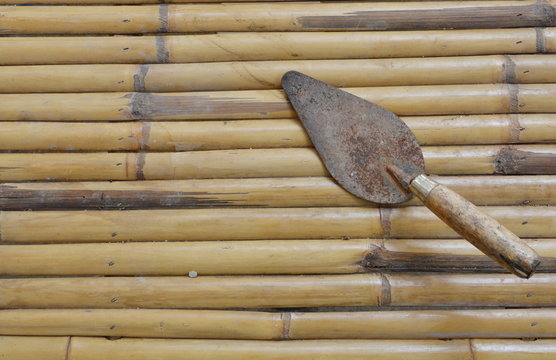 steel trowel on bamboo