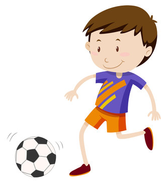 Boy kicing soccer ball