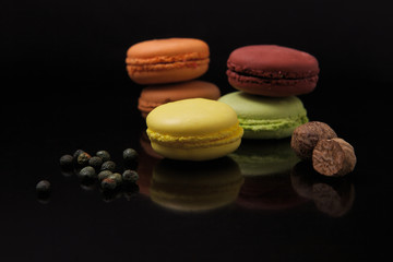 Macaroons on black surface