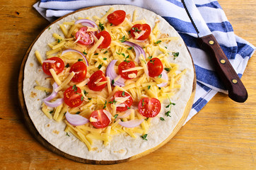 Flat tortilla with cheese and vegetables