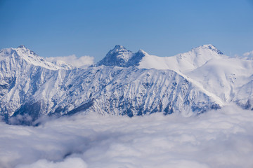 View on mountains and blue sky above clouds, Krasnaya Polyana