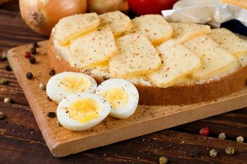 Healthy quail eggs and bread with aromatic cheese
