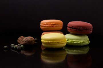 Macaroons on black surface