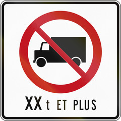 Canadian regulatory traffic sign - No lorries. The text means: XX tons and more. This sign is used in Quebec