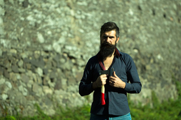 Stony wall and man with ax