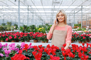 Nice florist working with flowers 