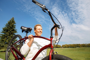 Obraz premium Adult man riding a bicycle 