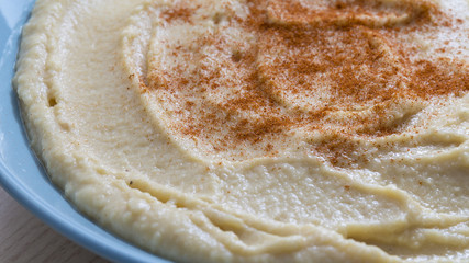 hummus food served on a blue dish