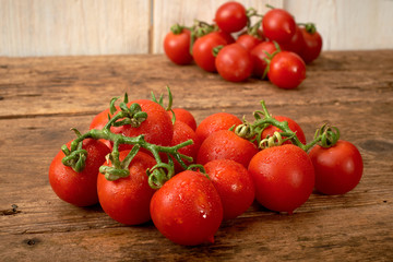 fresh tomato on wooden kitchen table