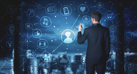 Businessman drawing social media connection scheme