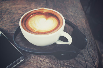 Smart phone with earphone and coffee cup